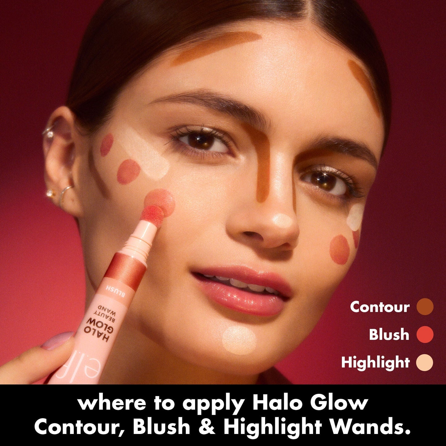 Woman applying makeup with Halo Glow contour, blush, and highlight wands on a red background.