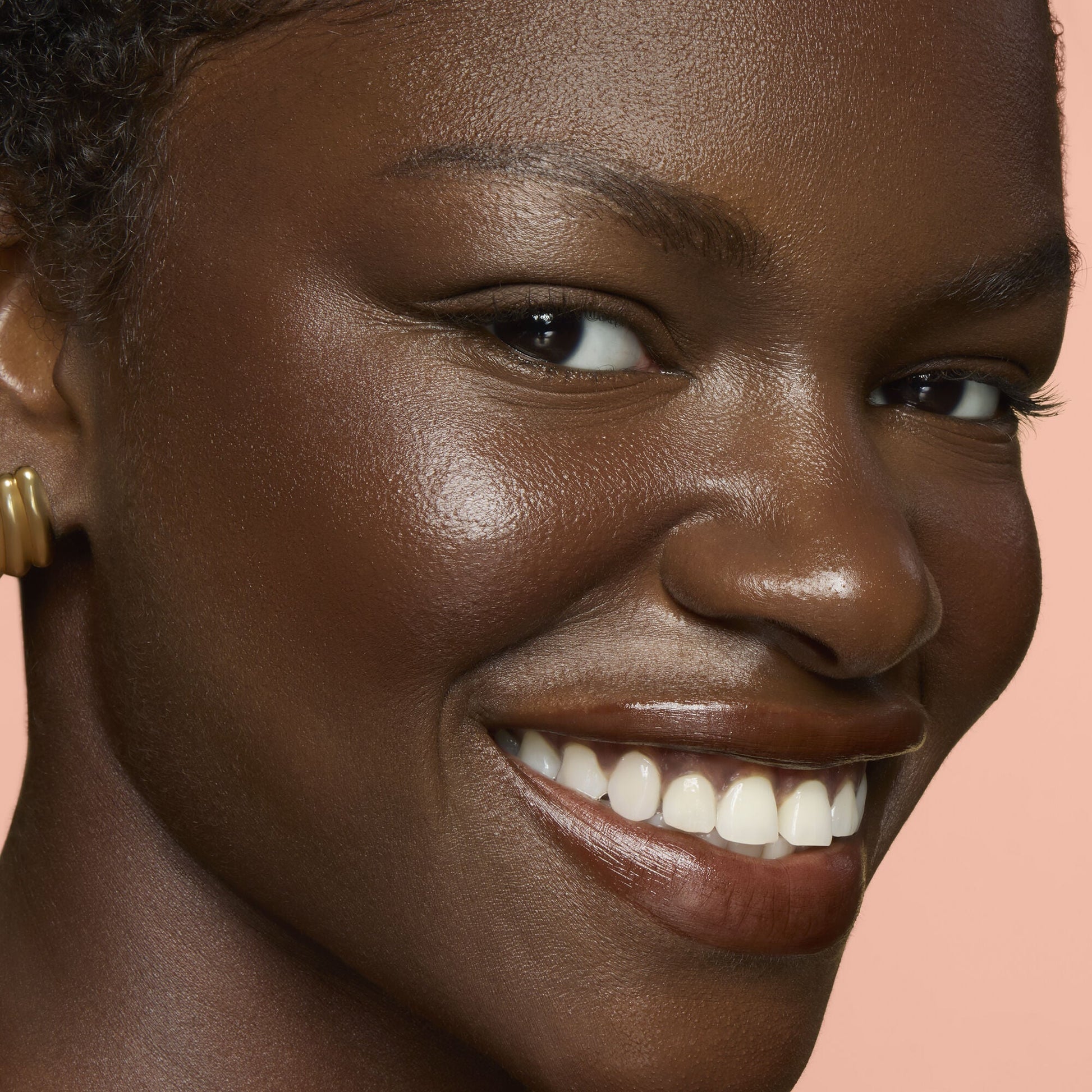 Close-up of a woman's face with Soft Glam Cream Bronzer